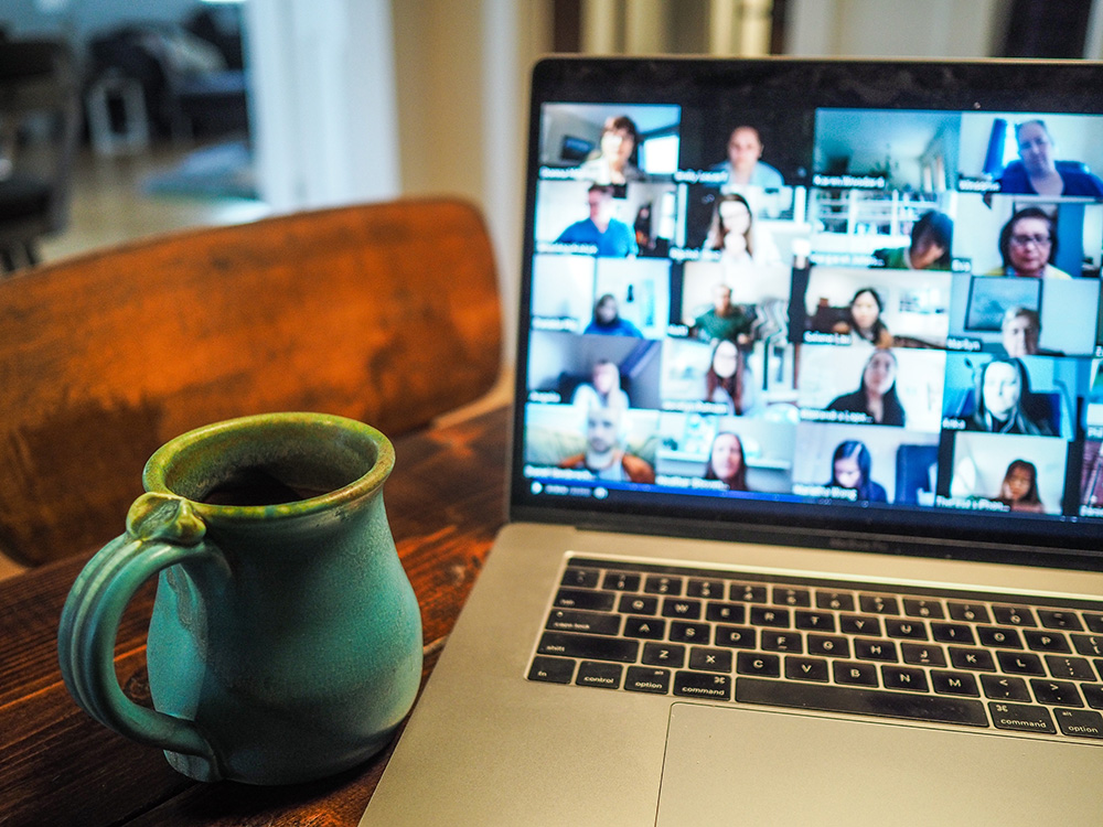A cup of coffee in front of the screen during a zoom meeting